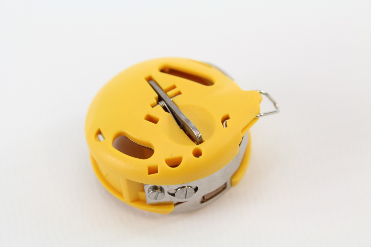 Original Bernina Spulenkapsel (gelb) Original Bernina Spulenkapsel (gelb)